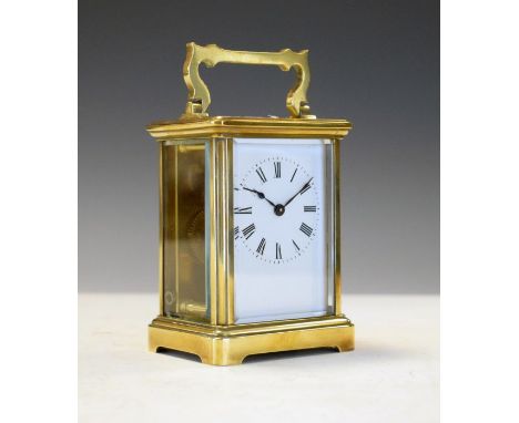 Early 20th Century French brass cased carriage clock, the white enamel dial with Roman numerals, 10.5cm high exclusive of fol