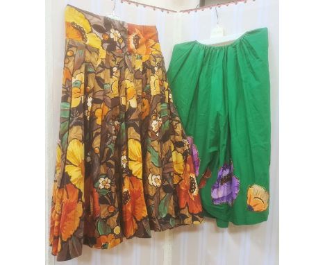 Two vintage 1950's cotton skirts, one green with large applique flowers around the hem , the other large sunflowers prints, B