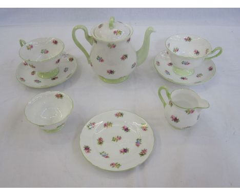 Shelley part tea service comprising of teapot, sugar bowl, milk jug, two cups and saucers and a small plate, floral pattern, 