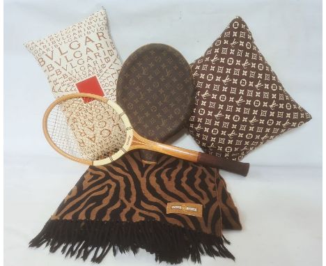 Bulgari silk cushion with the logo, a Louis Vuitton silk cushion with the logo, a Dunlop wooden tennis racquet with a Louis V