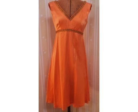 Vintage orange satin cocktail dress trimmed with gold and orange braid, five other 1980's-style dresses and a multi-coloured 