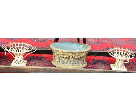 ~ A Carved Pine, Parcel Gilt and Cane Sided Oval Planter, with removable metal liner, the body decorated with floral swags an