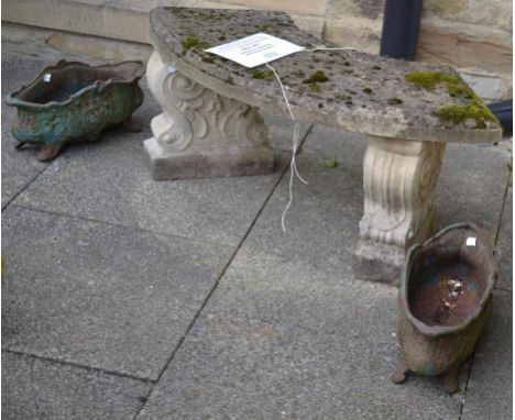 A Composition Garden Bench, of curved form raised on scrolled bases, 105cm diameter; and A Pair of Green Painted Cast Iron Pl