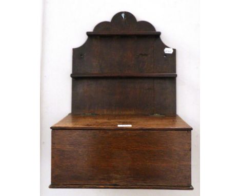 A George III Oak Spoon Rack, late 18th century, with two rails to store spoons above a hinged lid, 39cm wide
