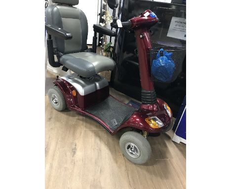 A RED MOBILITY SCOOTER