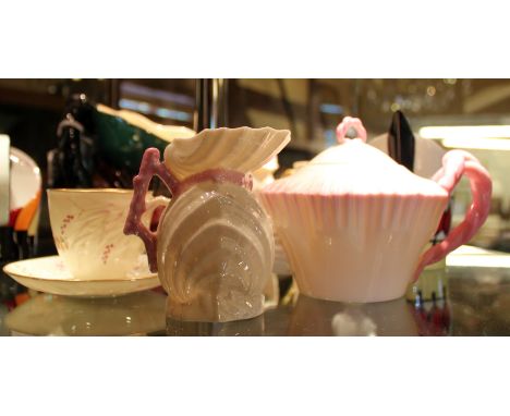 Belleek cup and saucer, first mark 1863~1890 and a teapot and milk jug, second mark 1891~1926