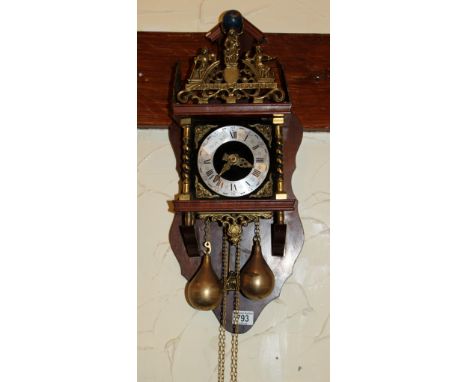 Mahogany cased wall clock with pear shaped weights
