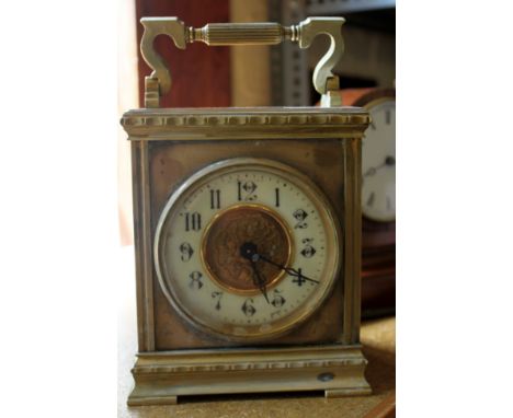 Eight day brass carriage clock with key,  inscription for 1909, working at lotting up