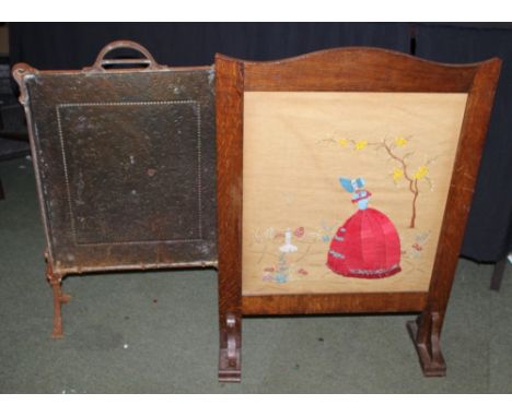 Two firescreens, one copper and one oak with tapestry