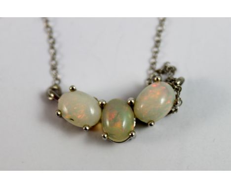 Silver three stone opal pendant