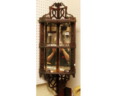 Mahogany fretwork corner whatnot shelf with bevelled glass mirrored back