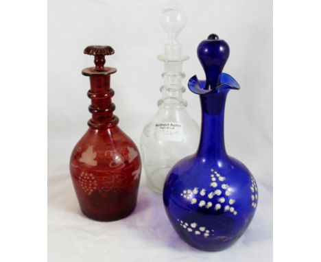 Three decanters, ruby glass, Bristol blue, and Georgian decanter