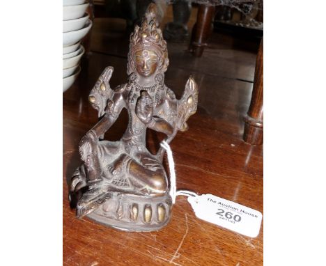 Bronze buddha with outstretched leg