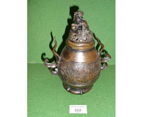 18th c. Chinese bronze two-handled censer having pierced cover with lion finial, 19cm tall