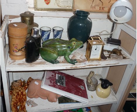 Assorted items on two shelves including china frog, brass and horn lantern, carriage clock etc