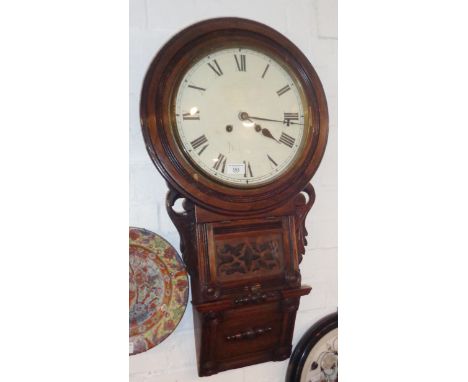 Victorian drop dial 8 day wall clock, 11" diameter dial in carved mahogany case