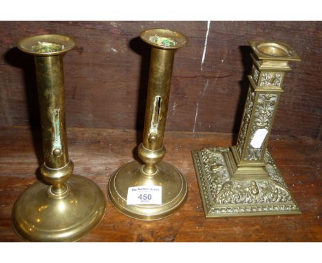 Pair of early 19th c. brass push-up candlesticks and classical relief brass candlestick