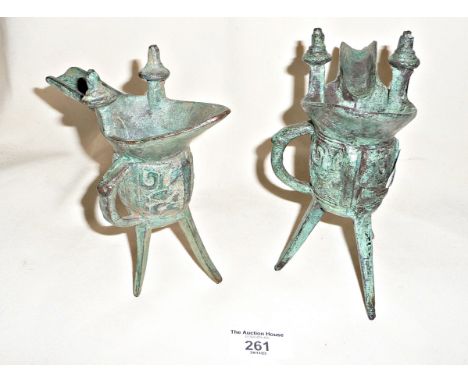 Two Chinese bronze Jue libation cups on tripod legs