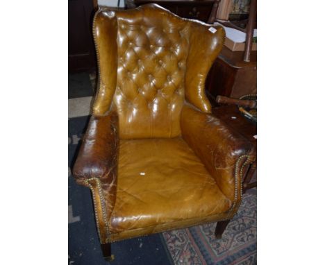 Late Victorian leather button back wing armchair