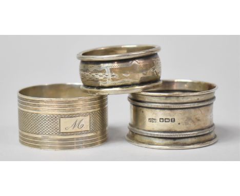 A Collection of Three Various Silver Napkin Rings 