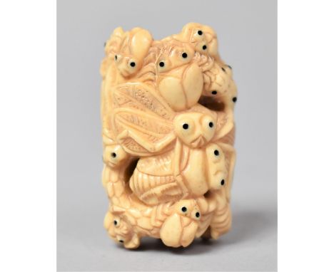 A Carved Bone Netsuke in the Form of Entwined Black Eyed Bugs, Signed, 5cm long 