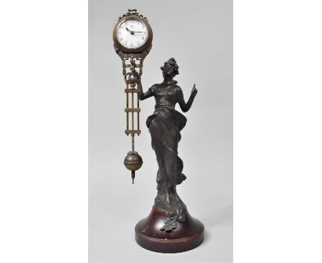 A Reproduction Bronze Spelter Mystery Clock in the Form of an At Nouveau Maiden with Finger Pointing Upwards, Circular Socle 