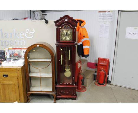 A Daniel Dekota grandfather clock with instruction guide