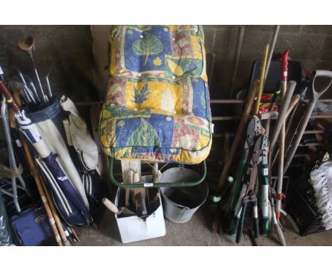 A metal framed lounge chair with cushion; a galvanised pail with swing handle and quantity of builders tools, trowels, cuttin