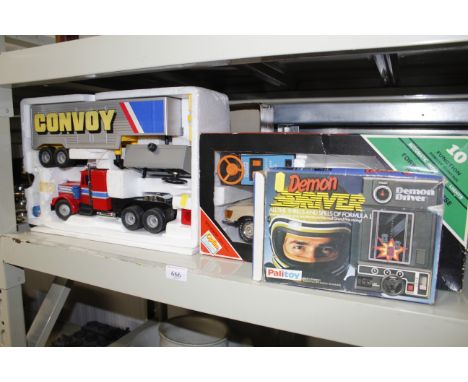 A Corgi Truckatronic Convoy in original box, a Demon Driver game together with an Ecstasy model of a Mercedes Benz 450-SLC in