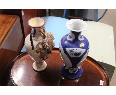 An Oriental blue and white vase with double ring marked base AF and a floral encrusted vase