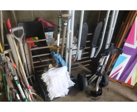 A quantity of various items to include a digging fork, three piece fishing rod, various metalware, serving trays, mirror, bla