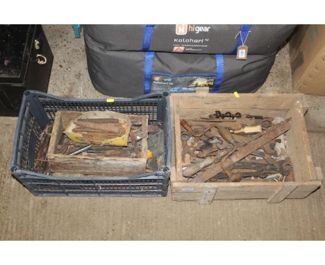 A wooden box and contents of vintage tools to include hand brace, vintage spanners, and another plastic box containing variou