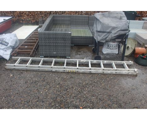 An aluminium extending ladder (approx. 116" long when closed)