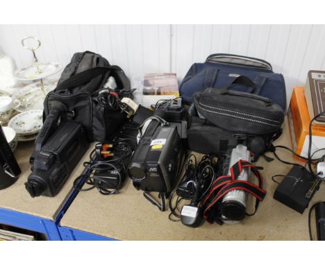 A quantity of various camcorders including Cannon, Canovision E6, JVC compact VHS camera, various camera bags etc 
