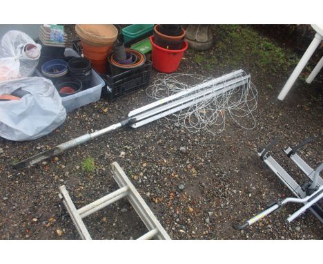 A rotary garden clothes airer and ground stake 