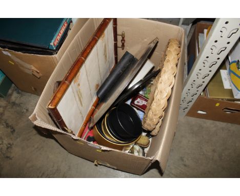 A box containing various items to include tile topped serving tray, a pair of wooden bellows, various metal baking tins and t