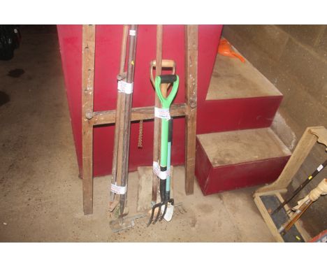 Two bundles of long handled tools to include rakes, hoes, digging fork, spade etc.