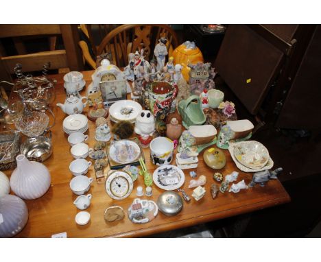A quantity of various ornaments; a cat shaped biscuit jar; various crested china; a floral decorated china mantel clock etc.