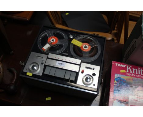 A Ferguson reel to reel player in case 