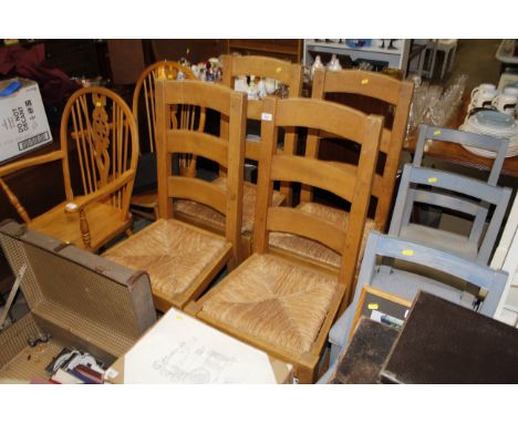A set of four heavy ladder and rush seated kitchen chairs 