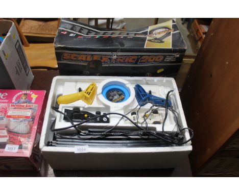 A Scalextric 200 electric model racing game with original box sold as a collectors item