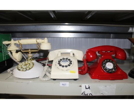 Three various rotary style telephones 