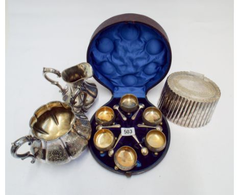 A small group of silver plated items to include 6 salts complete with their spoons boxed, tea caddy, milk jug and sugar bowl