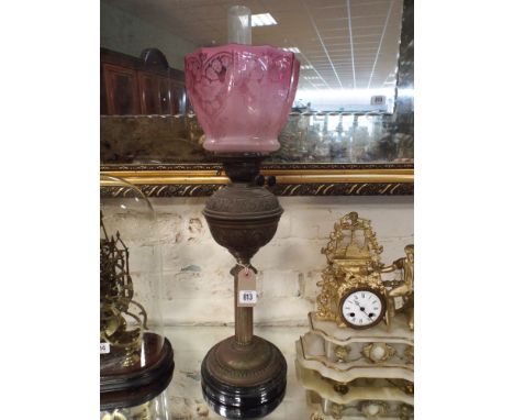 Victorian brass corinthian column oil lamp with pink glass shade, overall height approx 29"     No obvious sign of damage or 