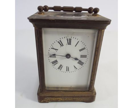 French brass carriage clock with white enamel dial measuring 11cm tall 