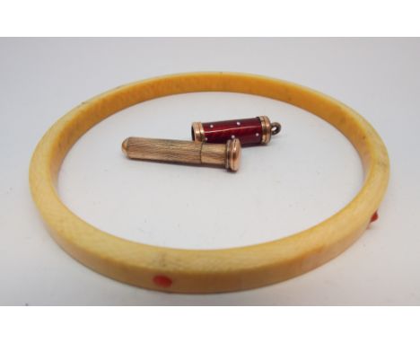 A large antique ivory bangle inset with coral cabochons and an enamel propelling pencil       Bangle is 9cm diameter and penc