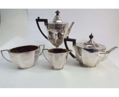 A Victorian 4 piece hallmarked silver tea and coffee service of octagonal form, London hallmarks 1885, ebony handle and finia