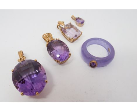 Four large modern amethyst pendants set in 9ct yellow gold and a amethyst set dress ring