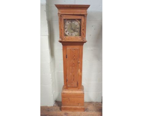 30 hour country grandfather clock with square brass dial in a stripped pine case 