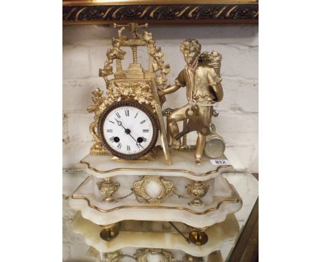 French striking mantel clock in gilt figure mounted case standing on white marble base 